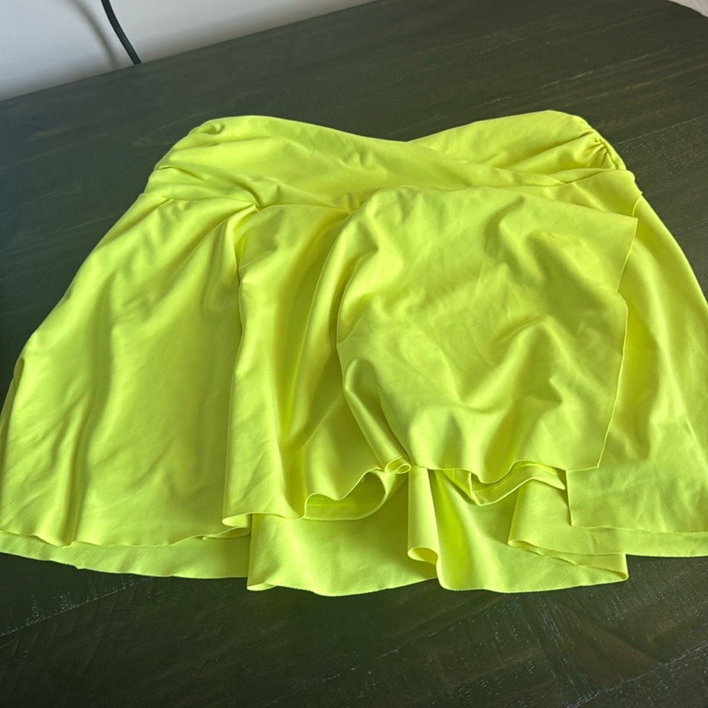 A neon yellow tennis skirt